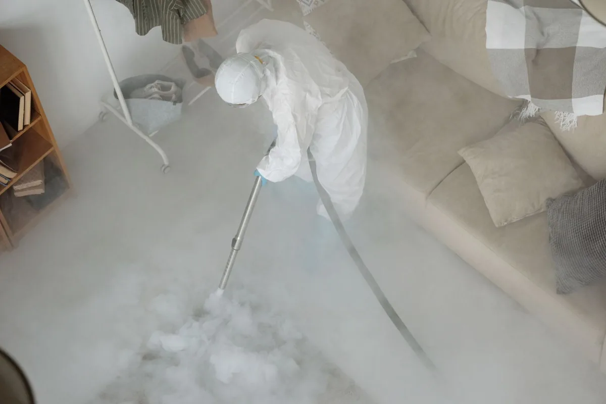 Biohazard cleanup technician in protective equipment, Spring Glen, UT